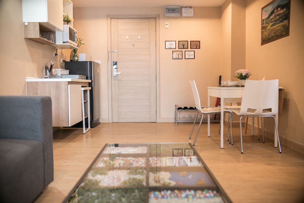 The table by the couch has custom and unique artwork.