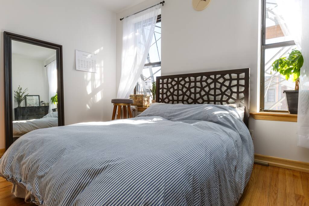Full length mirror, full-sized bed with true down comforter, two large windows, fire escape (if you're feeling adventurous and want an outdoor seat)
