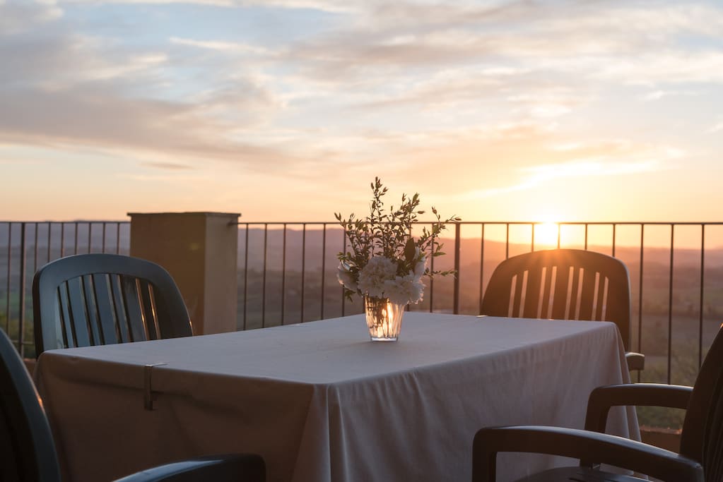 private table on the panoramic sunset terrace (more than 180° on the Tuscan countryside)