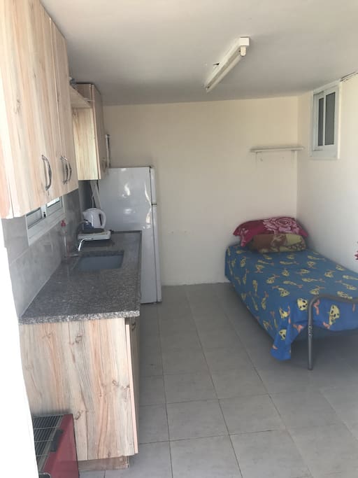 Kitchen and a sitting/sleeping corner