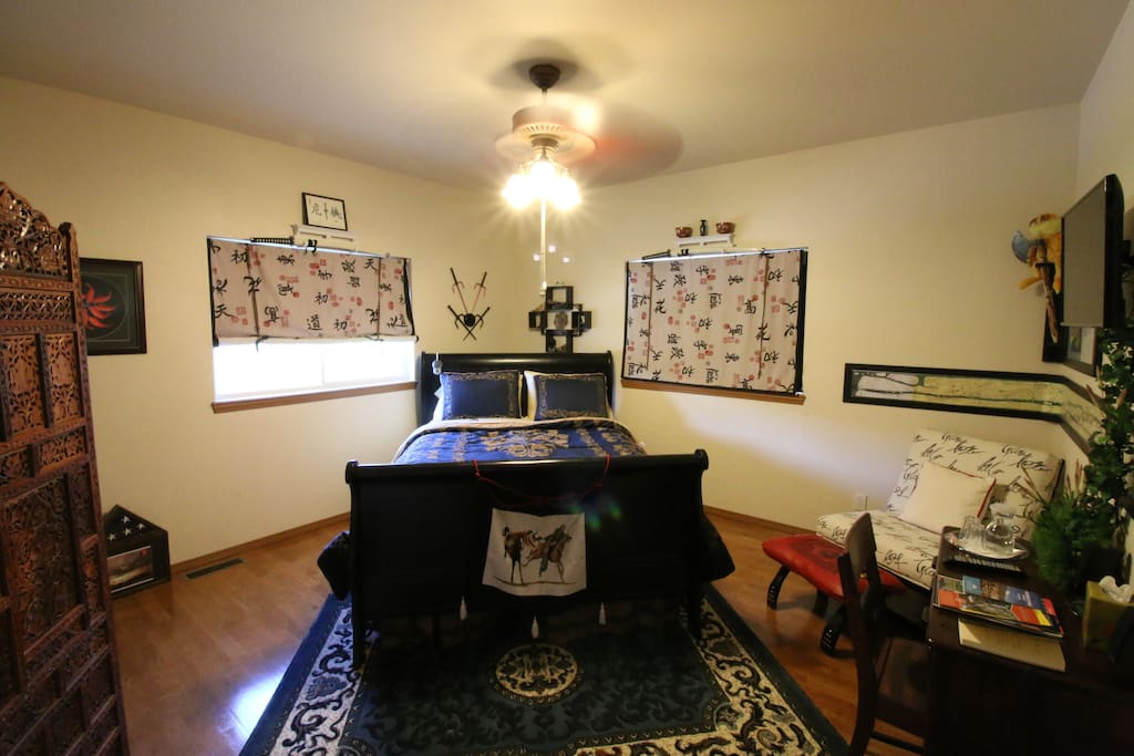 The Eastern room has a writing desk, smart TV, easy chair and wonderful bed.