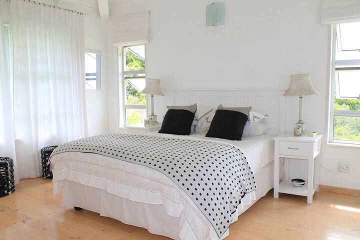 Upstairs bedroom with enclosed balcony