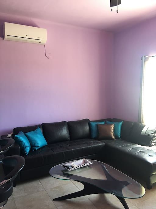 Comfortable leather sectional in sitting room..