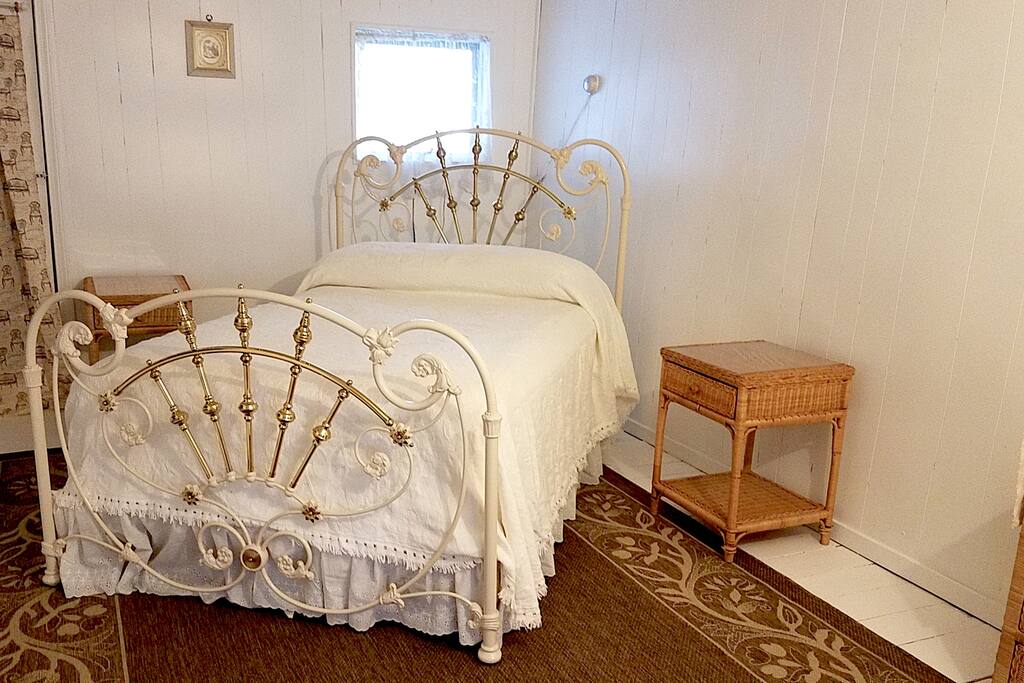 Full-size bed with an air mattress to sleep a total of 4.