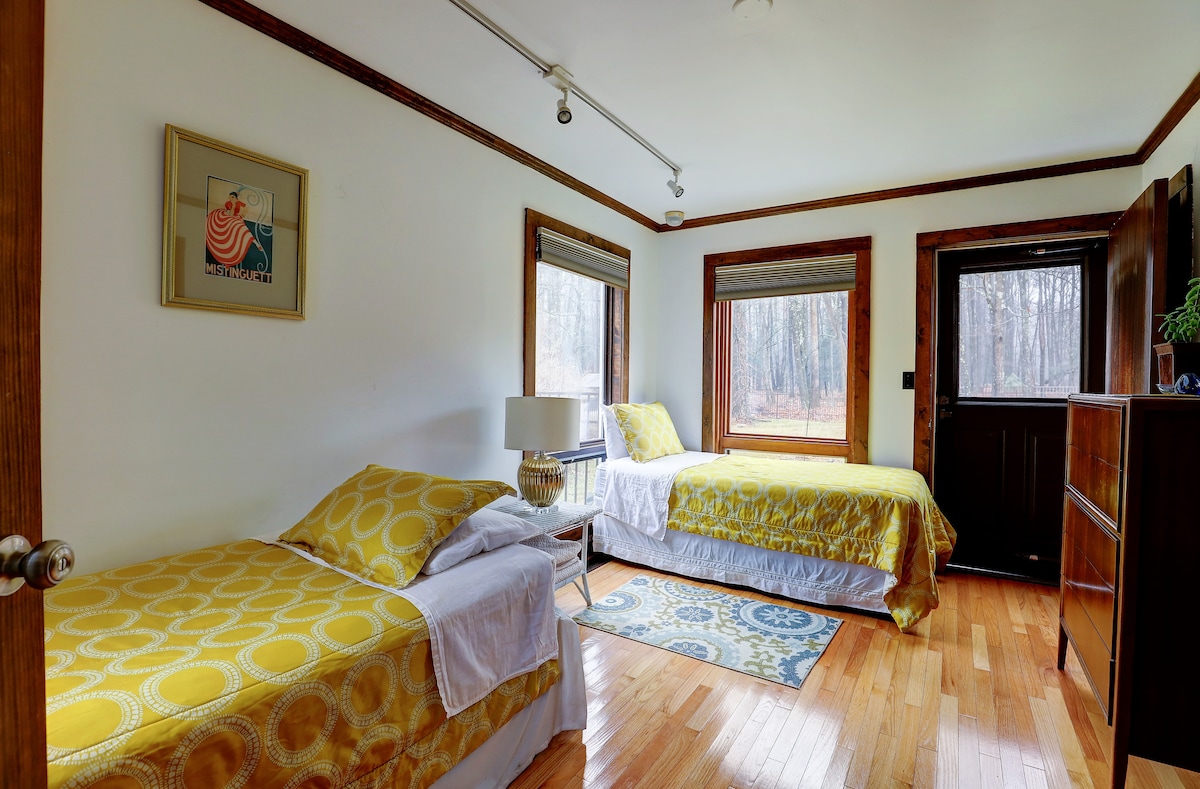 Our "twin" bedroom. These beds can be easily put together. Walk out into the backyard. Full bathroom with shower adjacent. 