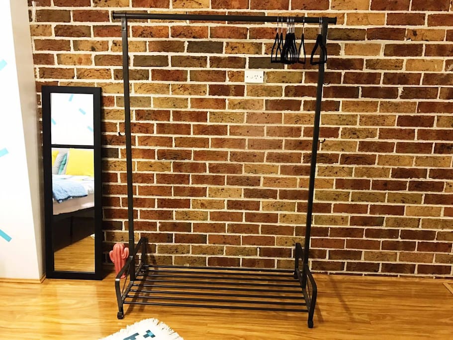A clothes rack for you to hang whatever you like! Clothe-hangers are at the ready, and more can be offered if you need them.