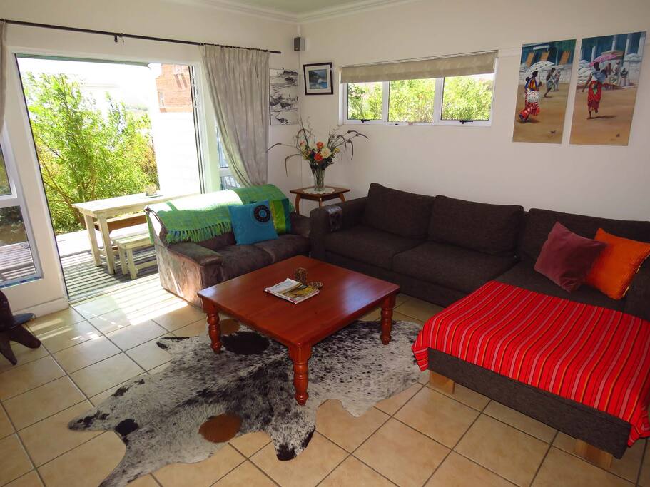 Living room flowing to sheltered veranda