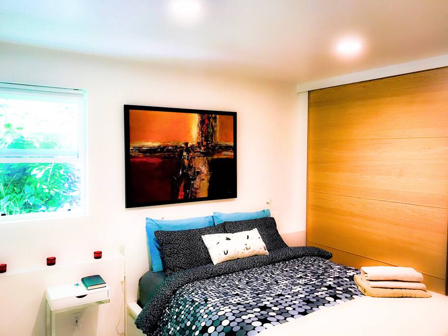 Bedroom with a new queen size luxury pillow top mattress and a huge sliding door closet
