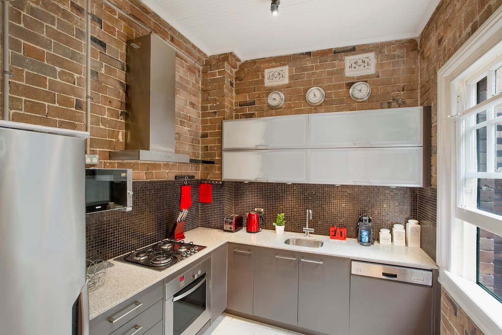 Super stylish industrial warehouse style kitchen is fully equipped with everything you could need