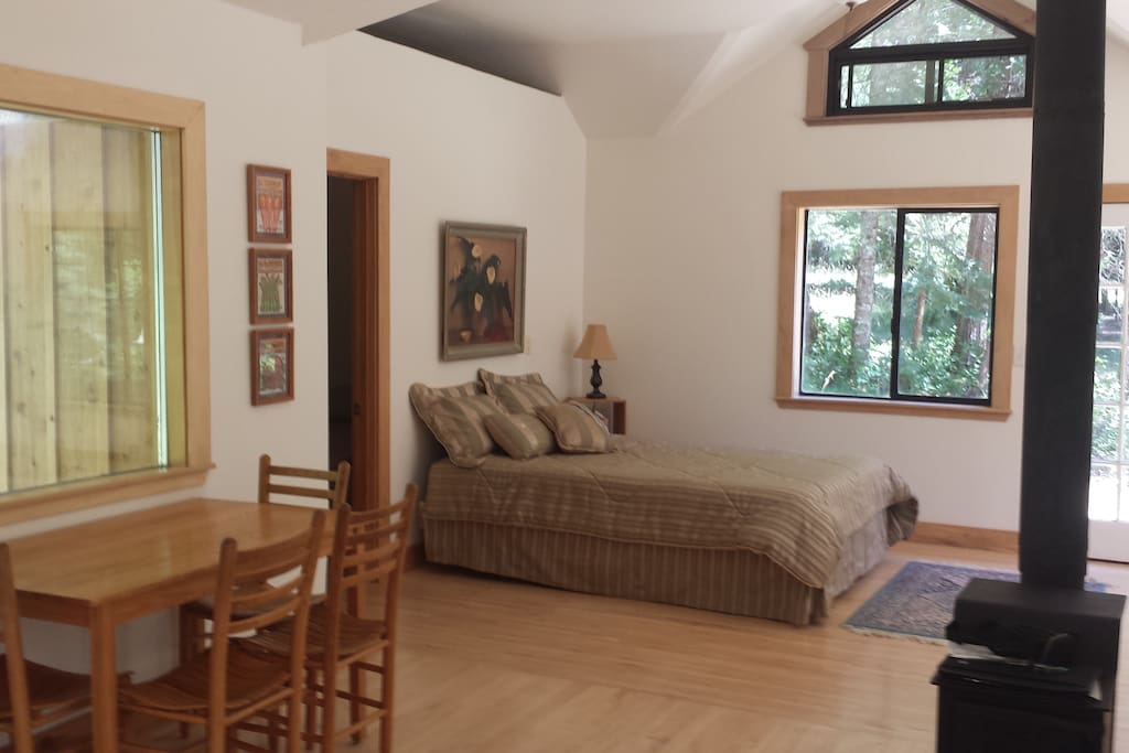 Open sleeping area off of the living room and dining area