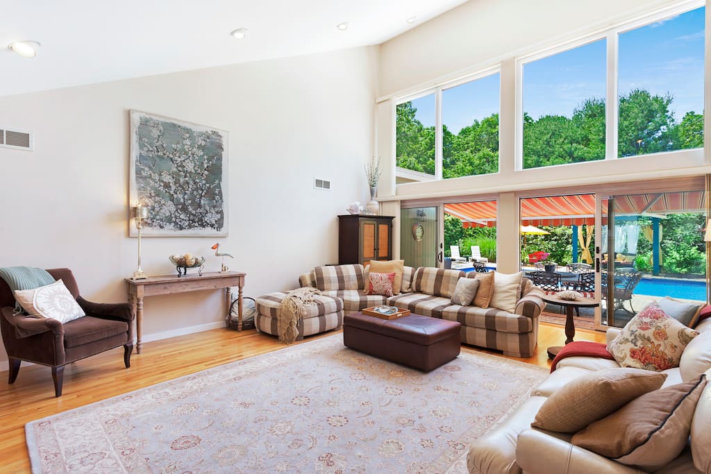 Spacious living room with fireplace and flat screen TV