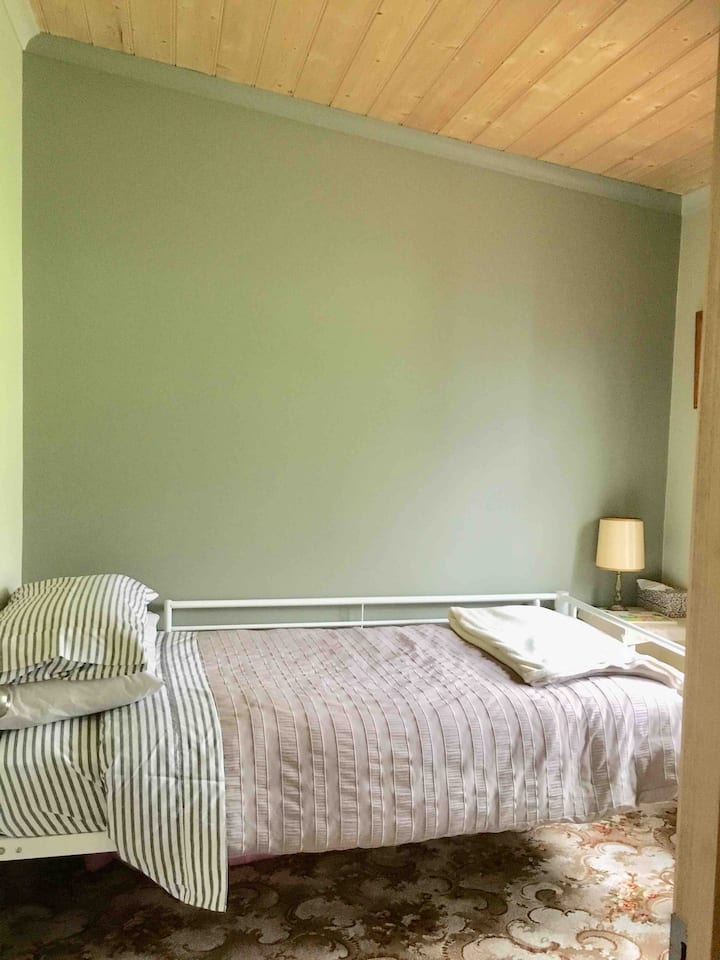 Single room with views to the chickens and sheep paddock and back deck