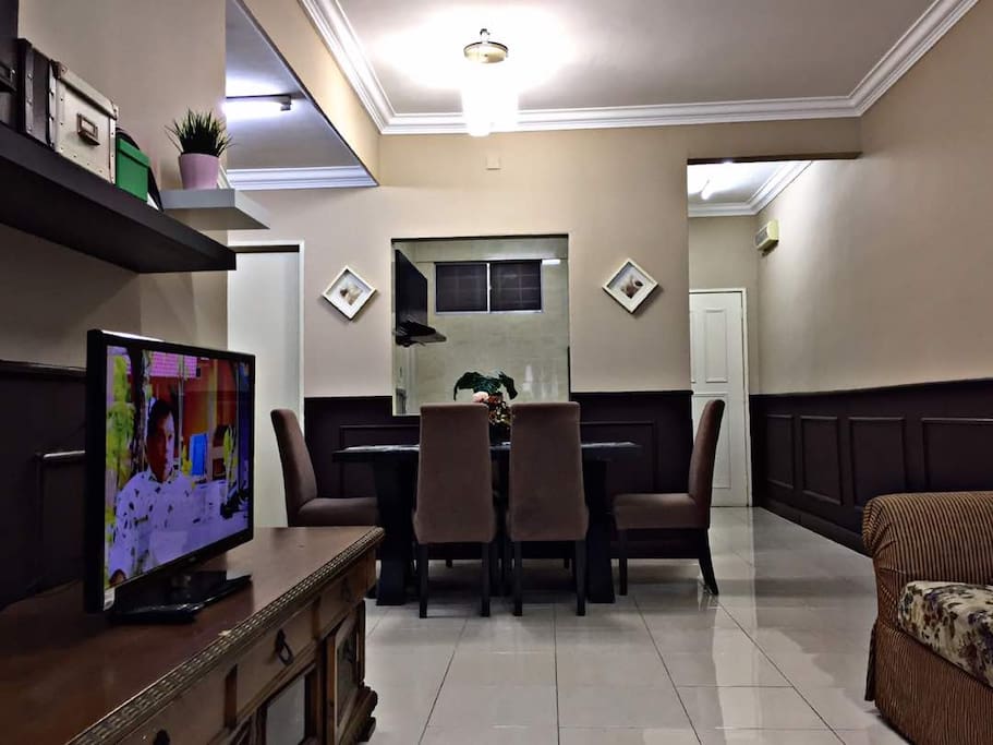 View from living hall to dining area with an opening overlooking the kitchen near the dining table. Food can be passed on through the opening. Great place for cooking and chatting.
