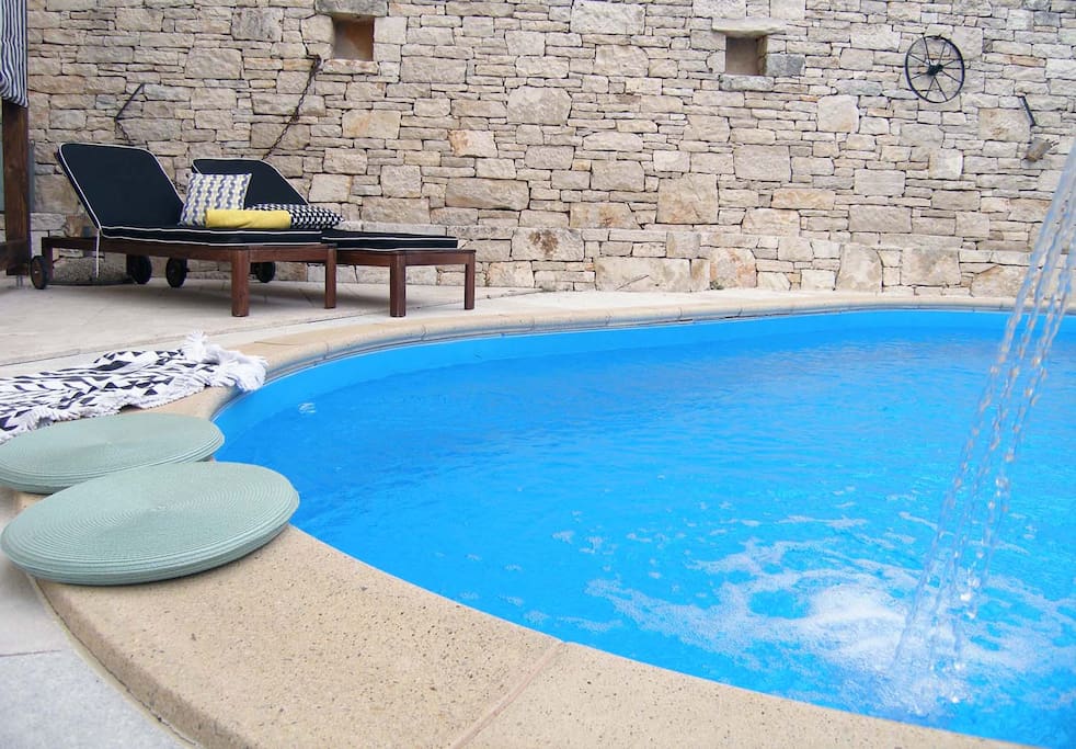 An outdoor swimming pool is available for a refreshment during hot summer days
