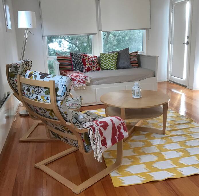 Sunny retreat lounge with TV and outdoor deck