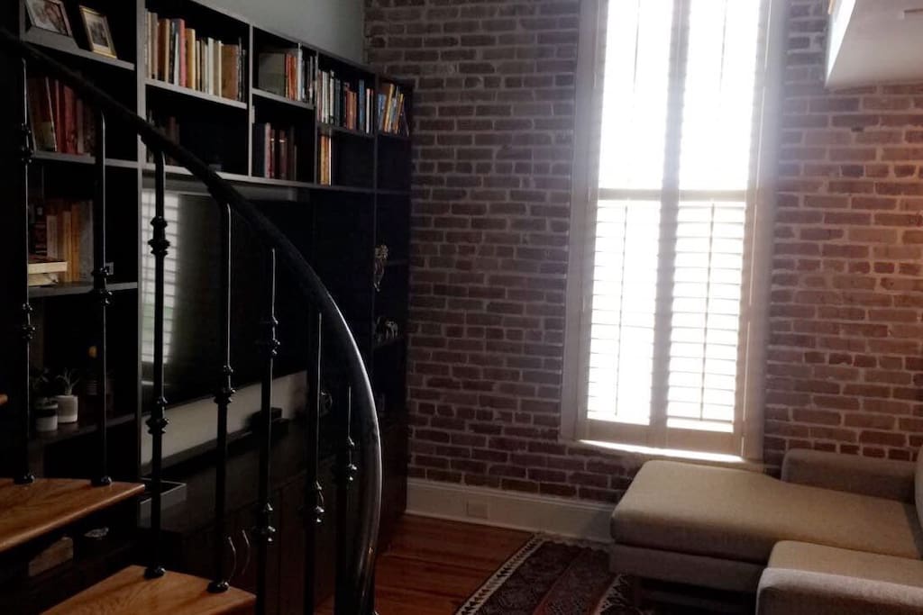 View from entryway , exposed original 1800’s brick wall