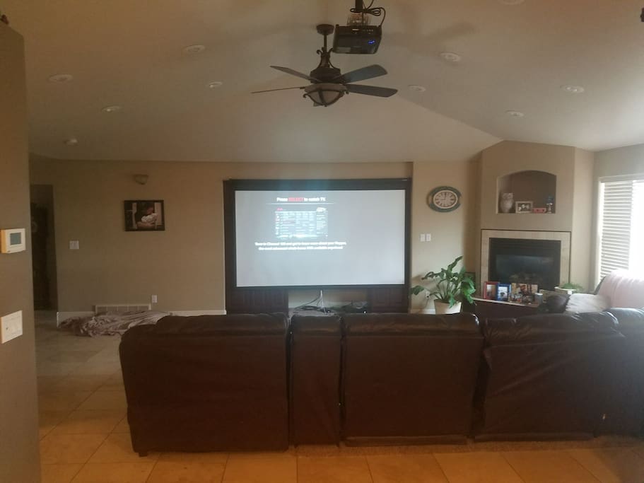 144 inch projector with surround sound for movies and entertainment and news Dish Network hooked up