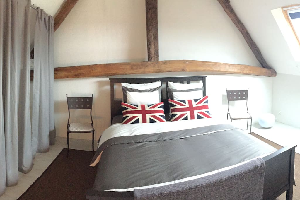 Main Bedroom: Kingsize Bed with Firm Sprung Mattress, 13TOG Duvet and 4 Large Pillows. 4m rail with hangers is provided behind curtains for clothes storage. Large Velux window with Black out blind.
