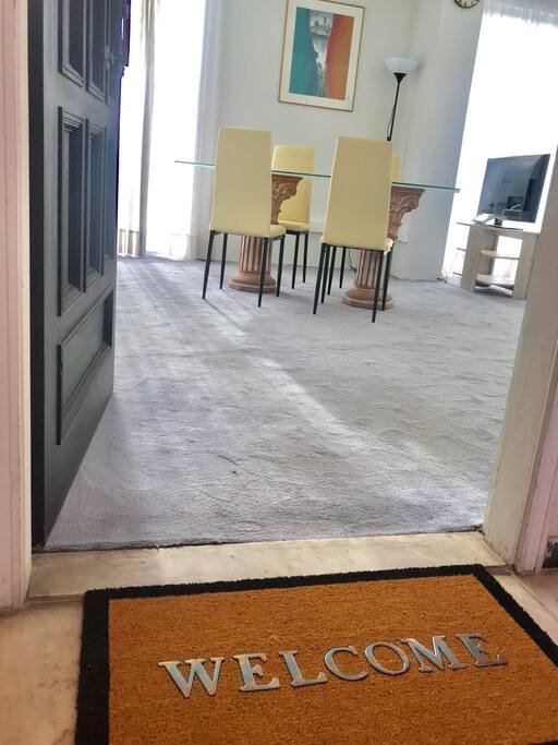 welcome entrance to living room and dining table