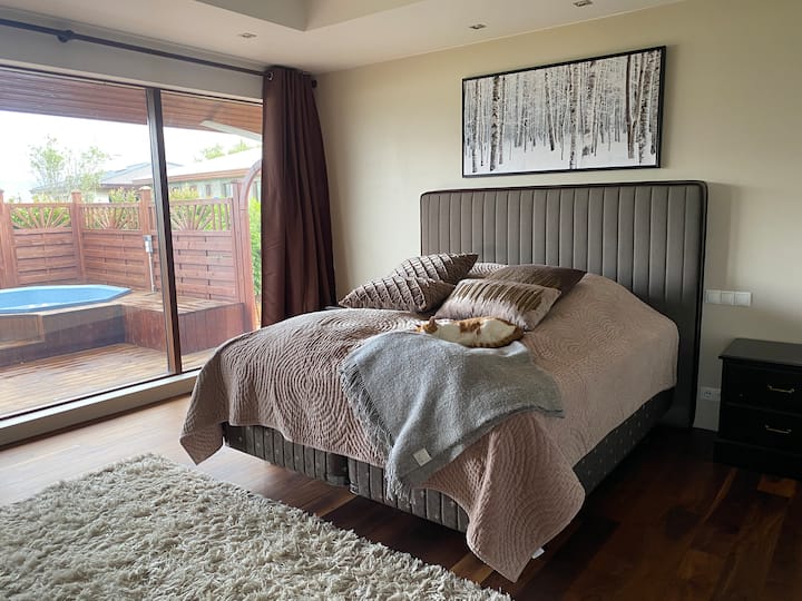 Master bedroom with access to hot tub and master bathroom
