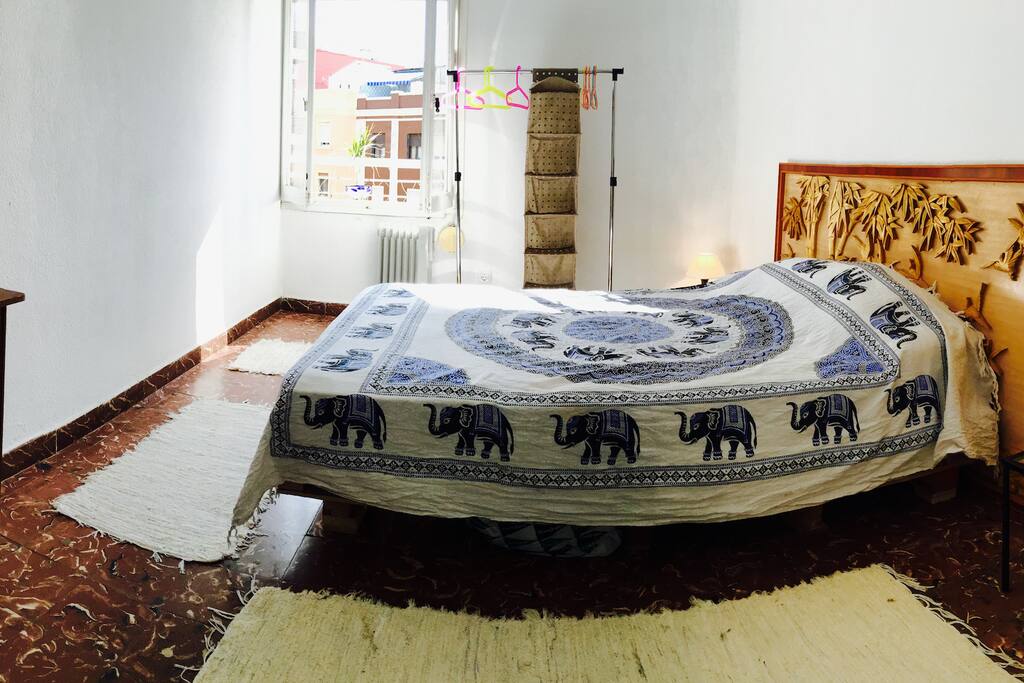 There are two rooms in the flat and this is the main one. It has a double bed and has a lot of light in it. It accommodates two people and is very private.