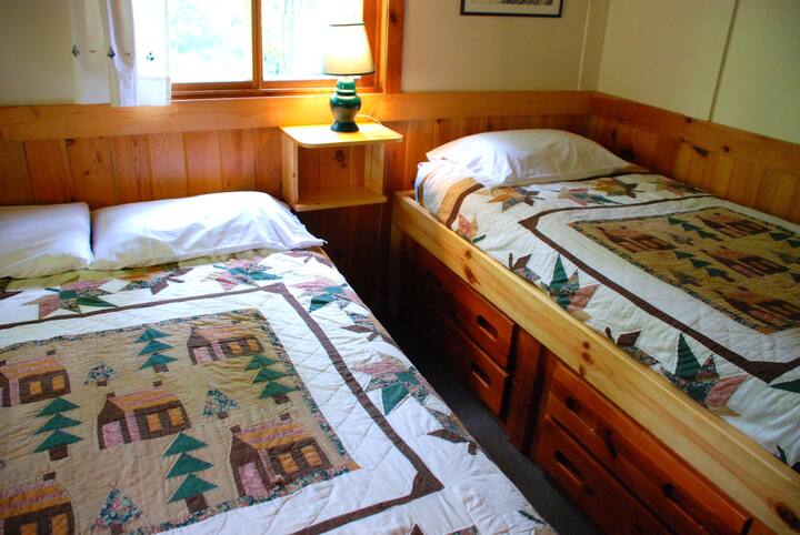 Back bedroom w/ a full bed and a twin captains bed.