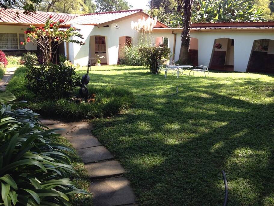 Tranquil view of main house with cottage on Right hand side