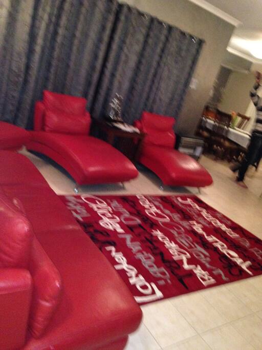 Lounge/Family room: 65" TV with local channels, comfy leather lounge suite, overlooking kitchen, dining and alfresco area.