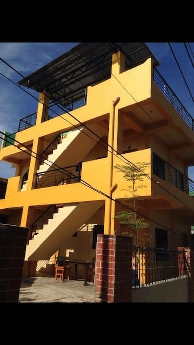 a new 2 story building with four studio type rooms.
