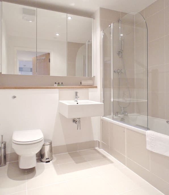 Full bathroom with shower over bath