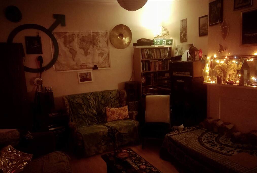 Chill evening vibes in the living room, it has 3 couches so we all have space to work & movie nights.