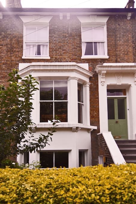 A Victorian terraced house on a leafy street