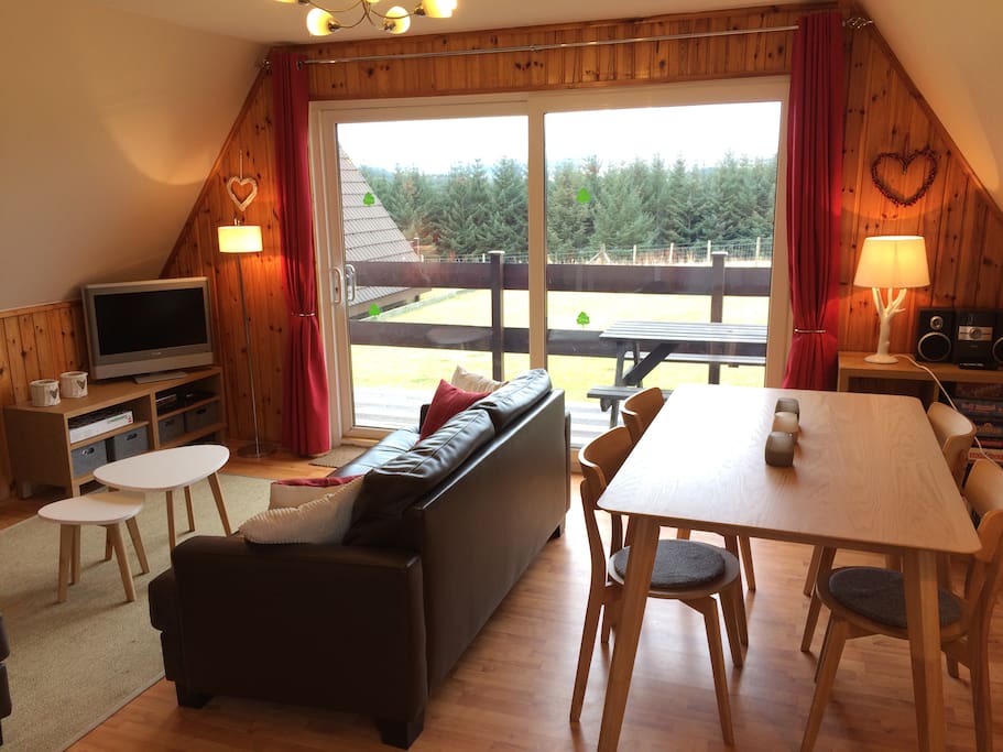 Living area with doors to sheltered veranda and large garden. Sattelite TV, DVD player with large DVD selection, Playstation and CD player with Ipod dock plus board games mean you're never without somethingto do.