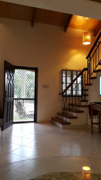 High-ceiling living room and staircase