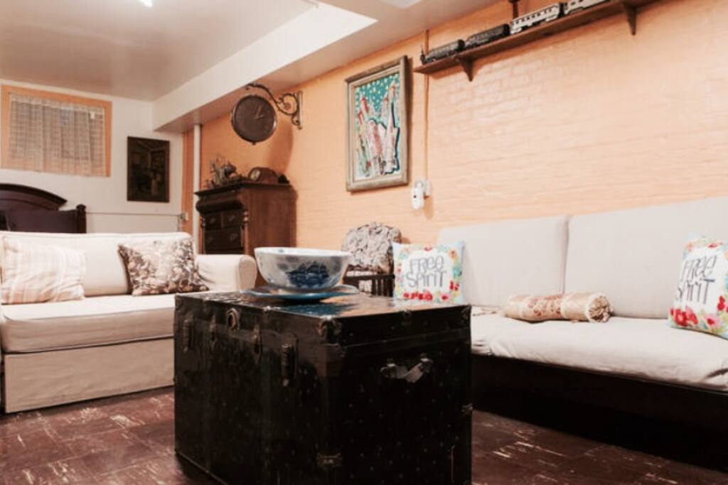 Main room has a sofa bed, two couches, and a bed