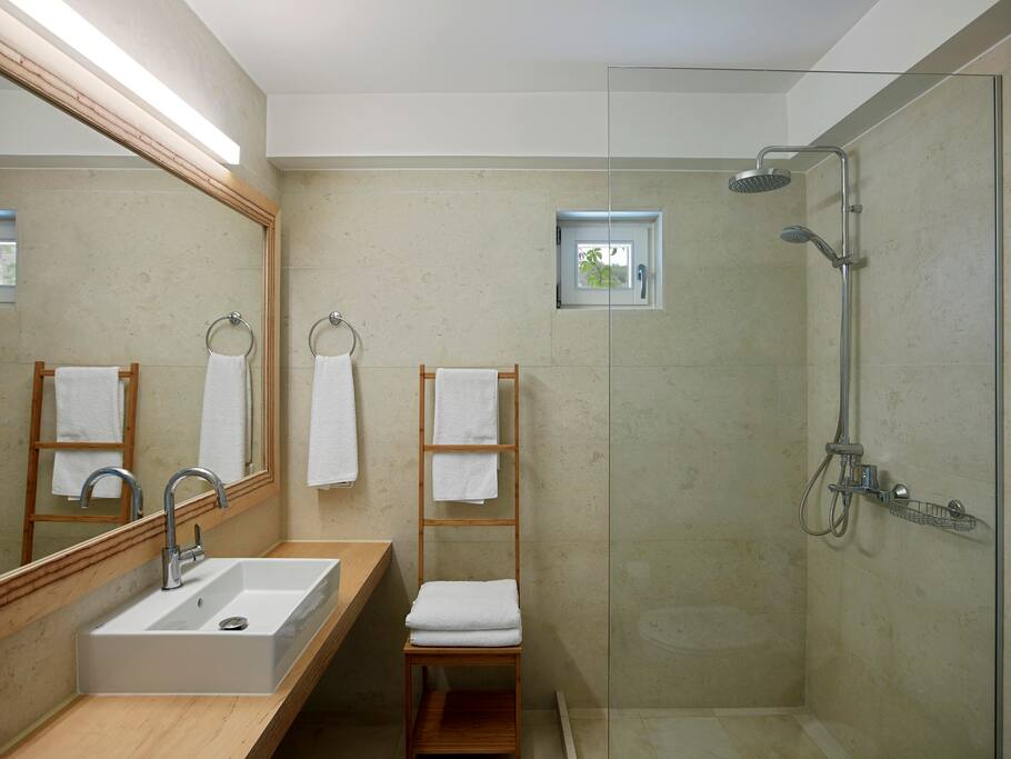 En-suite bathroom with a rain shower