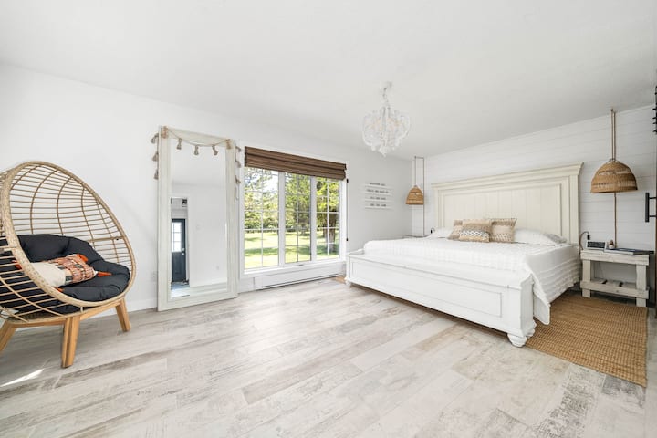 The "White Bedroom" is one of two primary bedrooms.  This large and spacious room is located on the main floor and features it's own private ensuite and king bed.  Inspired by the rustic village homes across the Mediterranean!