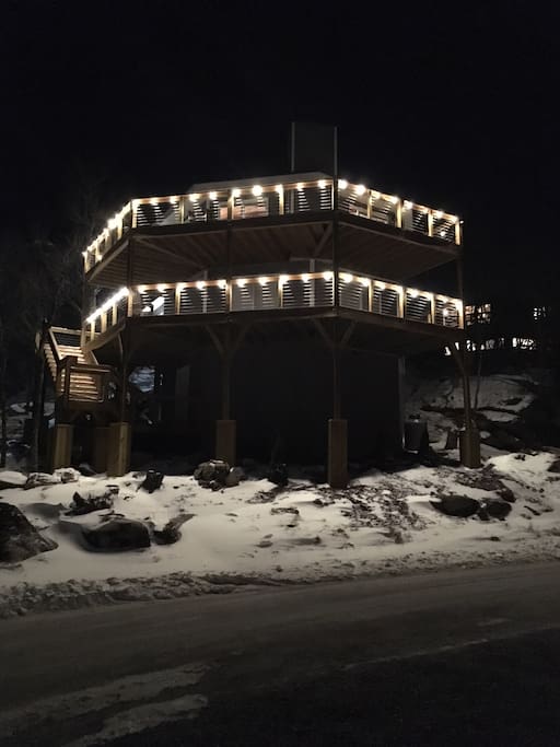 Deck lights reflect on the new-fallen snow. Deck is lighted year round.