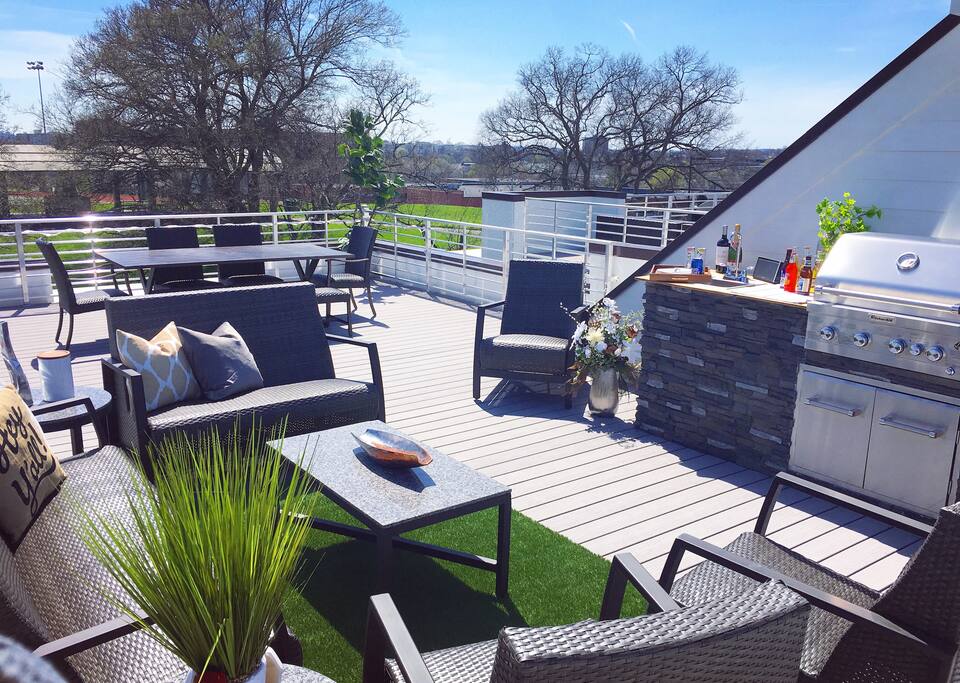 Gorgeous rooftop with skyline views, relaxing patio furniture, wet bar with grill & more!
