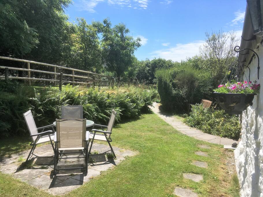 The secluded front garden is the perfect spot for afternoon tea in the sun. Our alpaca field is right outside too!