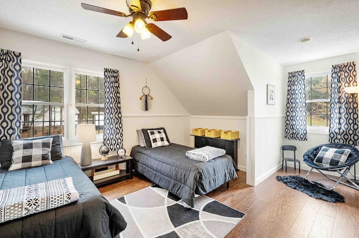 Upstairs bedroom 4 with 2 twin beds, storage, and reading nook