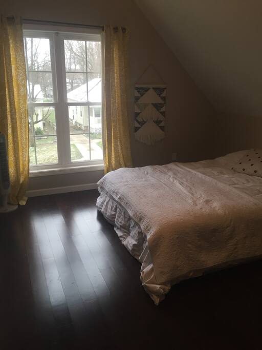 Bedroom with queen bed and office nook.