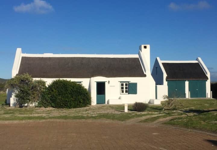 Beach cottage with unspoilt sundowner views.