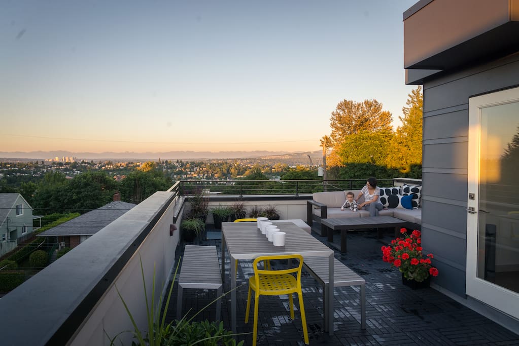 View from our rooftop lounge facing the Cascade Mountains and Mount Rainier (to the right) during a gorgeous, typical Seattle summer evening.