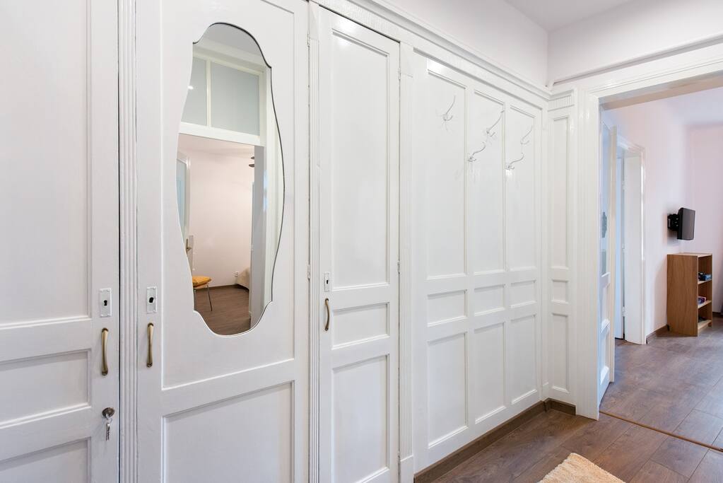 Hall with original wooden panels. We have completely refurbished the apartment but maintained original features.