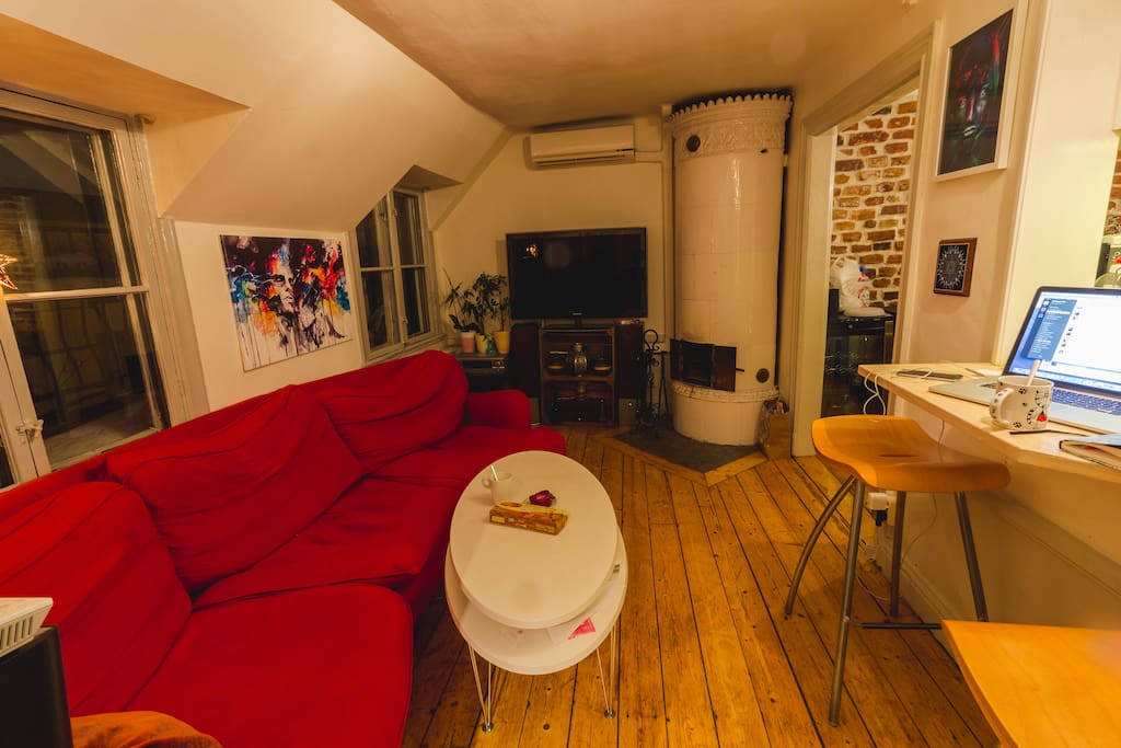 First floor living room with working fireplace and balcony