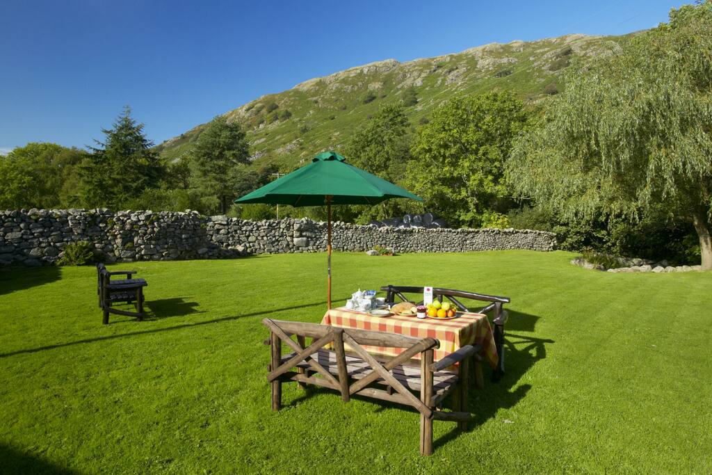 Enjoy breakfast or afternoon tea in our riverside paddock, beneath the fells!