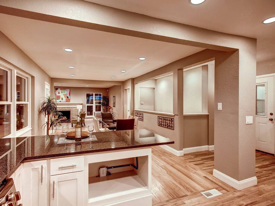 Open concept kitchen view of living and dining room.