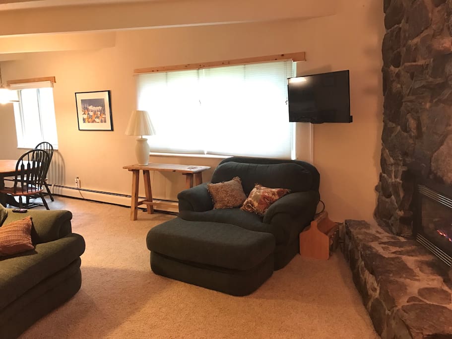 Relax in your living room with a gas fireplace and aspens shimmering outside the large picture window. Great view of fall foliage and the lake!