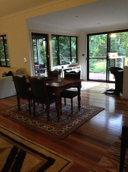 View through open plan living area through to sun deck and river reserve beyond